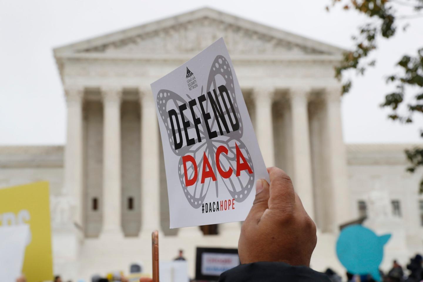 People rally outside the Supreme Court for DACA